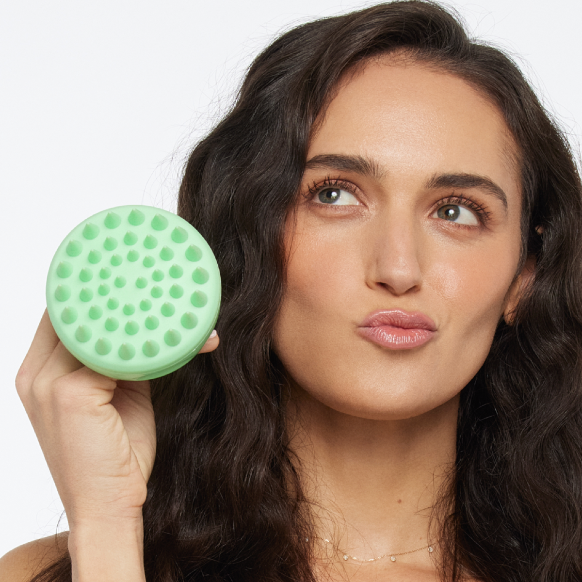 Girl holding scalp scrubber