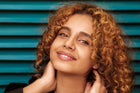 Woman with curly hair smiling